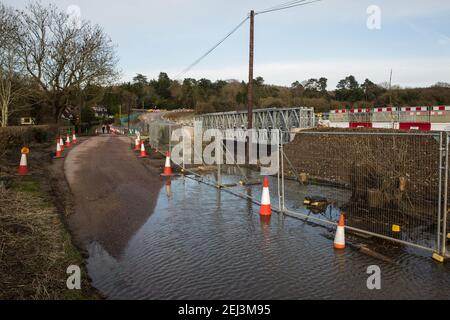 Chalfont St Giles, UK. 20th February, 2021. A raised temporary haul road is being prepared alongside Bottom House Farm Lane for use in the construction of a ventilation shaft for the Chiltern Tunnel on the HS2 high-speed rail link. Credit: Mark Kerrison/Alamy Live News Stock Photo