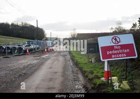 Chalfont St Giles, UK. 20th February, 2021. A raised temporary haul road is being prepared alongside Bottom House Farm Lane for use in the construction of a ventilation shaft for the Chiltern Tunnel on the HS2 high-speed rail link. Credit: Mark Kerrison/Alamy Live News Stock Photo