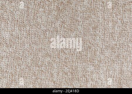 White and beige natural texture of knitted wool textile material background. Flat lay, top view. Stock Photo