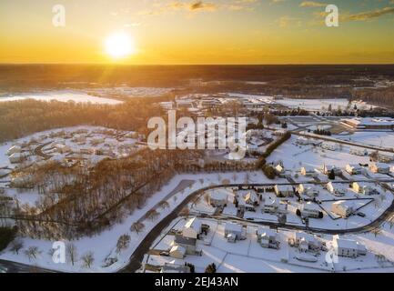Amazing winter landscape sunset scenery in residential streets after the snow of a small town peaceful America cold snowy day. Stock Photo