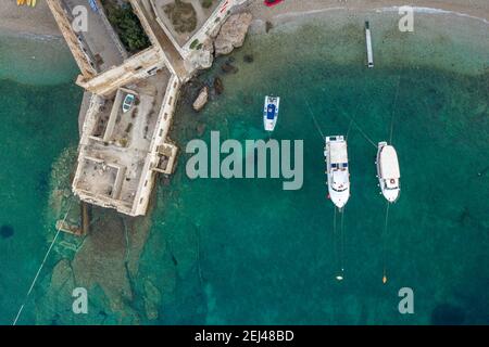 Aerial overhead drone view of yachts near Gusarica beach in Komiza on Vis Island in Coratia before sunrise Stock Photo