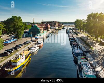 KLAIPEDA, LITHUANIA - AUGUST 9, 2020: Aerial view of beautiful yachts by the pier in the yacht club in Klaipeda, Lithuania. Klaipeda old castle site. Stock Photo