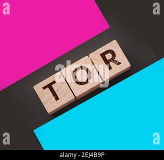 Tor anonymous by letters on a woden blocks on black. Business concept. Stock Photo