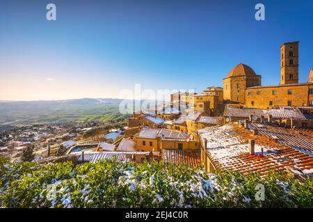Volterra snowy town in winter at sunset. Pisa province, Tuscany, Italy, Europe. Stock Photo