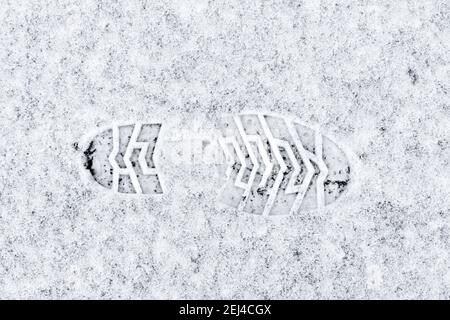 Imptint of boot sole in snow Stock Photo