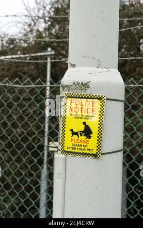Polite notice clean up after your dog Stock Photo