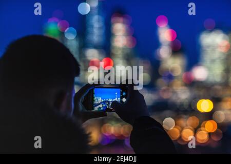 London Bokeh - Blurred Lights City of London Lights at Night - tourists view and take photos of the City of London Financial District at night. Stock Photo