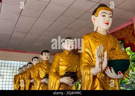 Buddhas lining up in the Su taung pyi pagoda, Myitkyina, Kachin state, Myanmar Stock Photo