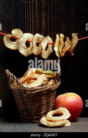 Dried apple slices, dried apple rings strung on string, Gala variety Stock Photo