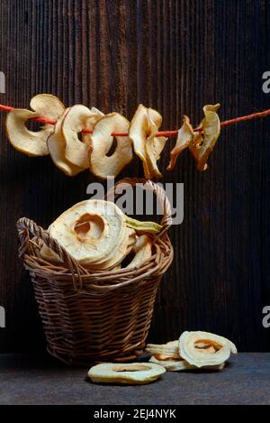 Dried apple slices, dried apple rings strung on string Stock Photo