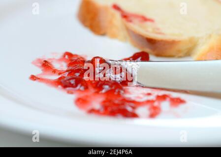 Jam and slice of braided butter, raspberry jam Stock Photo