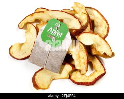 Dried Apple Rings with Tea Bag isolated on white Background Stock Photo