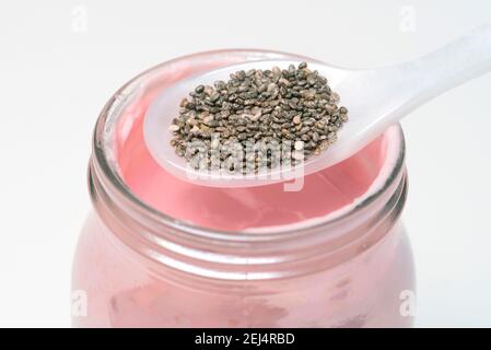 Chia seeds ( Salvia hispanica) on spoon, yoghurt Stock Photo