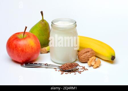 Yoghurt in glass with fruits and linseed Stock Photo