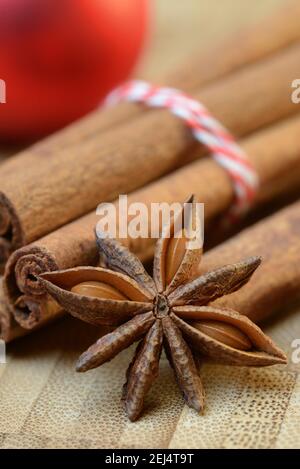 Cinnamonsticks and star ( Illicium verum) anise with Christmas tree ball, , stick, star anise, anise Stock Photo