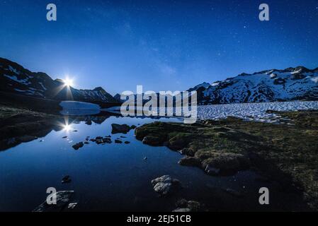 Maladeta range and the Aneto peak at night with the Moon. Viewed from the other side of the valley, near to Port de Benasque (mountain pass, Benasque) Stock Photo