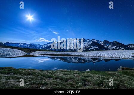 Maladeta range and the Aneto peak at night with the Moon. Viewed from the other side of the valley, near to Port de Benasque (mountain pass, Benasque) Stock Photo