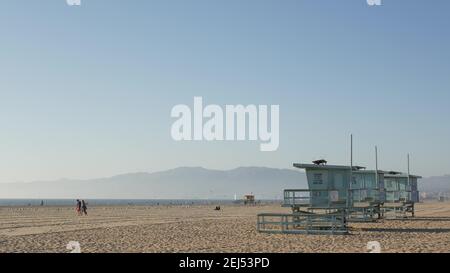 LOS ANGELES CA USA - 16 NOV 2019: California summertime Venice beach aesthetic. Sea gulls on sunny california coast, iconic retro wooden rainbow lgbt Stock Photo