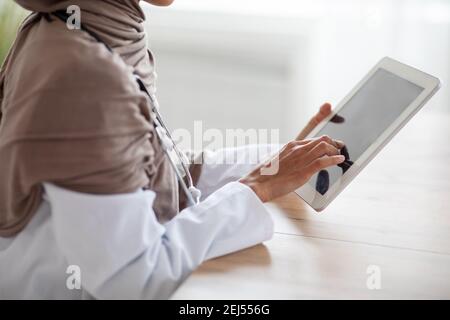 Cropped of female doctor using digital tablet Stock Photo