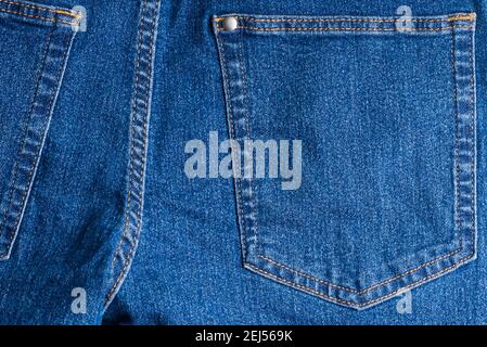 jeans pockets. blue jeans macro texture background. Stock Photo