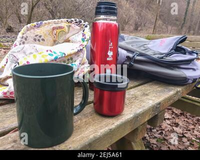 Asti-February-2020 Refreshing break during a trek in a natural park.Hot herbal tea with berries. Stock Photo