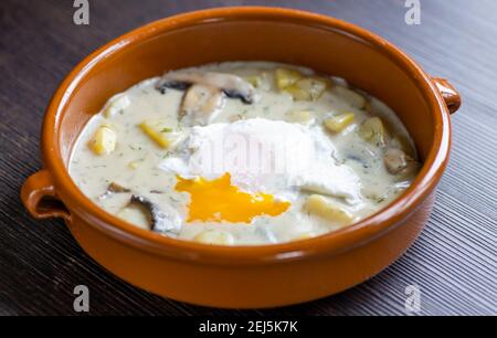 dill soup with poached egg Stock Photo