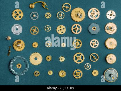 Vintage gears and cogs on blue background. Stock Photo