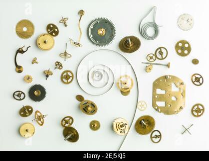 Clockwork spare parts. Metal gear, cogwheels and other details. Stock Photo