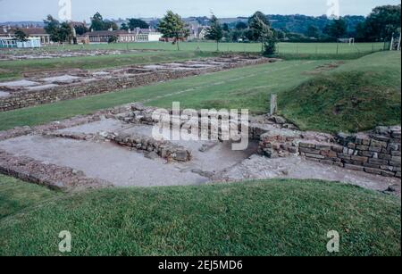 Caerleon near Newport, Wales - ruins of legionary fortress for 2nd Roman Legion Augusta. Cookhouse and turret with barracks in the back. Archival scan from a slide. October 1975. Stock Photo