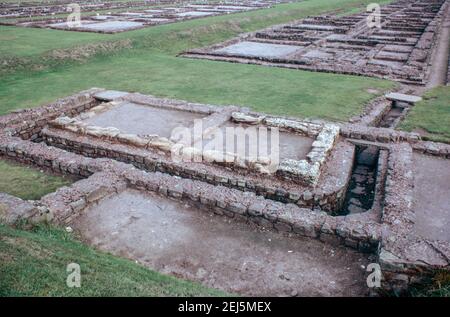 Caerleon near Newport, Wales - ruins of legionary fortress for 2nd Roman Legion Augusta. Latrine and culverts with barracks in the back. Archival scan from a slide. October 1975. Stock Photo