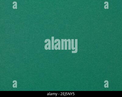 Dark green paper texture recycled. Uniform lighting no shadows clean. Stock Photo