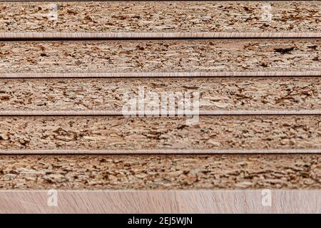 Stacked shelves. Veneer chipboard shelves. Production of wood furniture. Furniture manufacture. Close up. selective focus Stock Photo