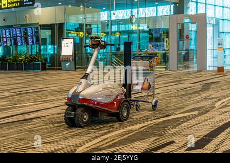 Airport Scooter for luggage trolley collecting at Changi International Airport Stock Photo