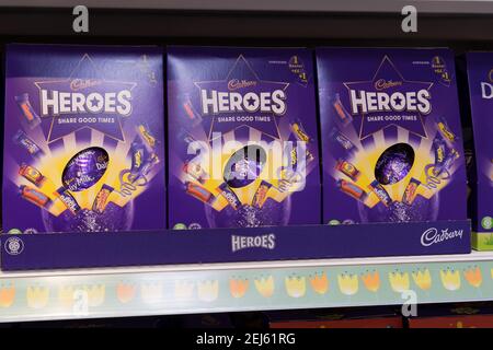 three boxes of  Cadbury Heroes chocolates in a row on shelf Stock Photo