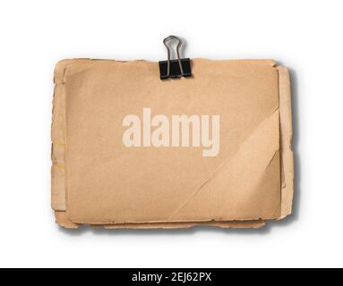 Blank aged paper sheets with metal clip isolated on white background Stock Photo