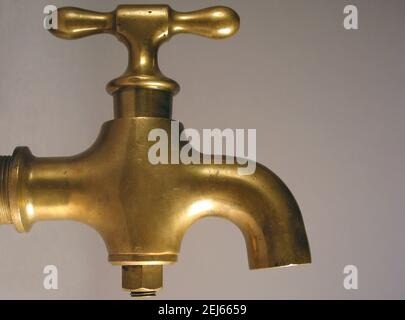 Antique brass water faucet Stock Photo