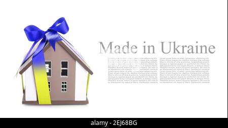 House model with ribbon and text MADE IN UKRAINE on white background with space for text Stock Photo