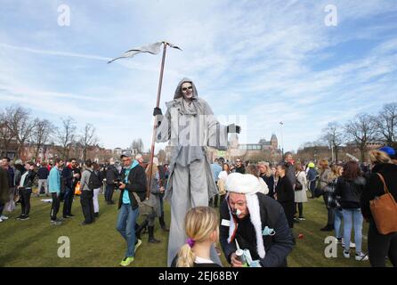 Anti-lockdown protester  dressed as the grim reaper during an illegal demonstration against coronavirus measures at the Muaeumplein  on February 21, 2