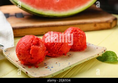 Plate with watermelon ice cream on table Stock Photo