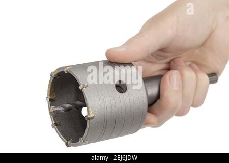 Female hand holding impact core drill, isolated on white background Stock Photo