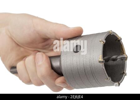 Female hand holding impact core drill, isolated on white background Stock Photo