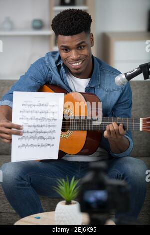 handsome man recording song - vlogging concept Stock Photo