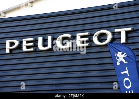 Martigues, France. 15th Feb, 2021. Peugeot company logo seen on one of their car dealerships showrooms. Credit: Gerard Bottino/SOPA Images/ZUMA Wire/Alamy Live News Stock Photo