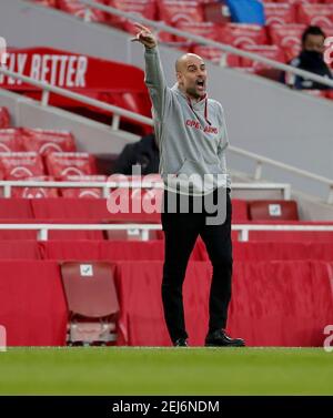 London, Britain. 21st Feb, 2021. Manchester City's manager Josep Guardiola is seen during the English Premier League football match between Arsenal and Manchester City at the Emirates Stadium in London, Britain, on Feb. 21, 2021. Credit: Han Yan/Xinhua/Alamy Live News Stock Photo