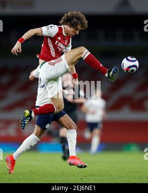 London, Britain. 21st Feb, 2021. Arsenal's David Luiz jumps for the ball during the English Premier League football match between Arsenal and Manchester City at the Emirates Stadium in London, Britain, on Feb. 21, 2021. Credit: Han Yan/Xinhua/Alamy Live News Stock Photo