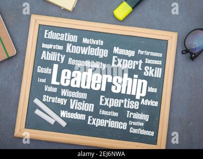 Leadership word cloud on black slate Stock Photo