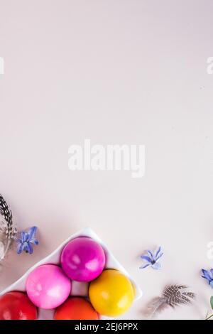 Colorful Easter eggs on a pink background. Bright Easter concept. Copy space. Stock Photo