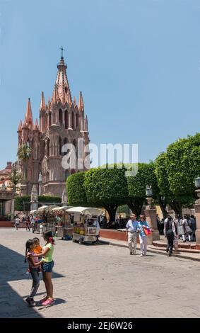 People in the central plaza in front of La Parroquia church in San Miguel de Allende, Guanajuato, Mexico with copy space Stock Photo