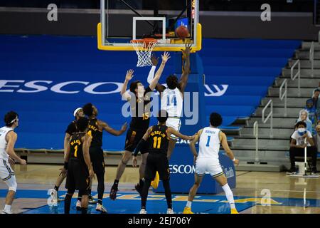 UCLA Bruins forward Kenneth Nwuba (14) jumps for a rebound during an NCAA basketball game against the Arizona State Sun Devils, Saturday, Feb. 20, 202 Stock Photo