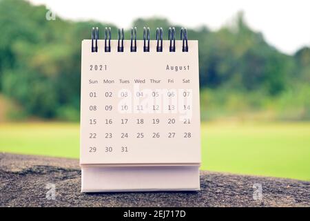 August 2021 white calendar with green blurred background Stock Photo